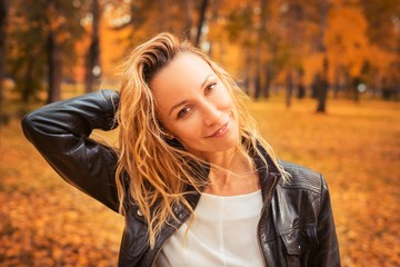 Portrait of a girl in the autumn park.