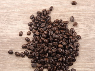 A pile of roasted coffee beans background.It  can be made into drinks and beverages,like latte,cappuccino, espresso.Economic crop in global trade business,agricultural products exports.