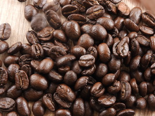Roasted coffee beans background.It  can be made into drinks and beverages,like latte,cappuccino, espresso.Economic crop in global trade business,agricultural products exports.