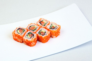 Sushi. Rolls with shrimp. Roll California with avocado. Japanese food. Healthy food is nicely laid out on a platter.