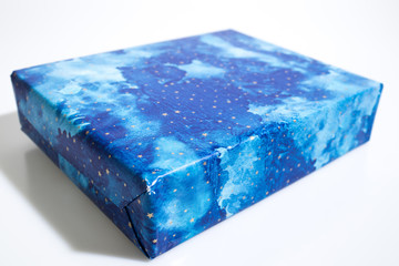 Blue christmas gift isolated in a white background