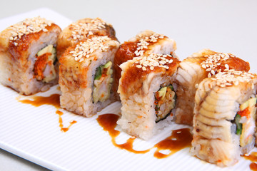 Roll Canada. Uromaki. Sushi in the nori. Japanese food on a beautiful dish. A delicious dish of japan.