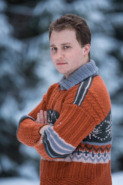 Man in warm knitted sweater outdoor
