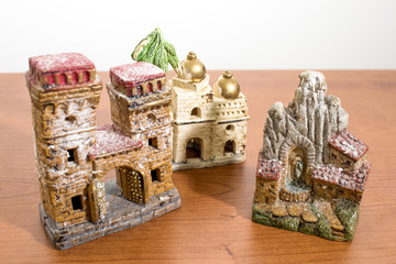 Christmas decorations, nativity scene houses on a wood table