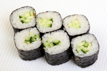 Roll with cucumber. Vegetarian food. Sushi in the nori. Japanese food on a beautiful dish.