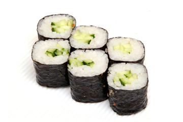 Roll with cucumber. Vegetarian food. Sushi in the nori. Japanese food on a beautiful dish.