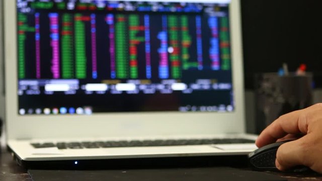Using laptop  trading  stock exchange