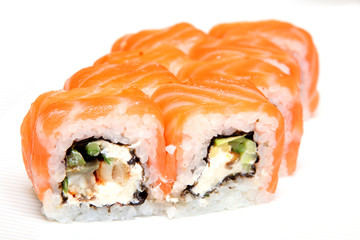 Roll Tokyo. Sushi with salmon, eel, tender cheese. Japanese food on a beautiful dish.