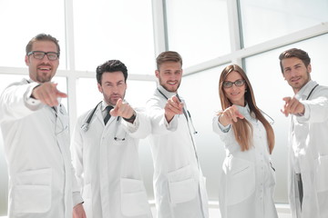 Fototapeta na wymiar group of practicing doctors pointing their finger at you