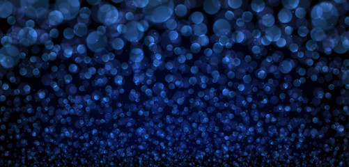 Blue abstract blurred background with bokeh effect.