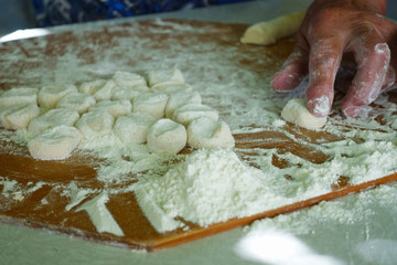 Home-made recipe for dumplings (raviol)i. Traditionally, women of the older generation mold the dumplings in the family.