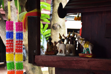 Fototapeta na wymiar The shrine of the household god is full of assume a god. There are seven color cloth