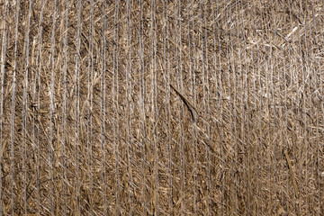 Close-up of straw bale drying on a sunny day.