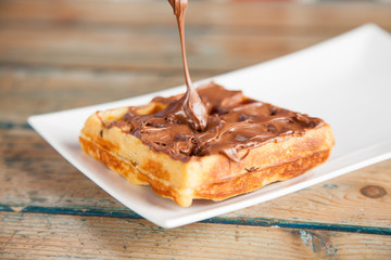 Dripping Nutella waffle pancake chocolate snack - obrazy, fototapety, plakaty