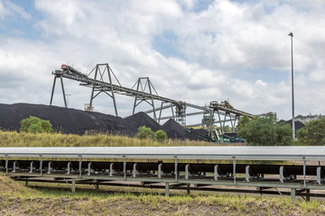 Obraz premium Coal mine conveyor and coal stockpile