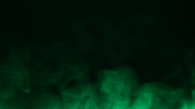 Colored cigarette smoke on a black background. Vape