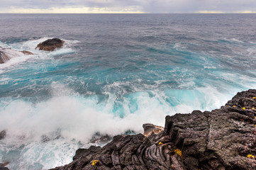 Wave Crashing into Volcanic Rock