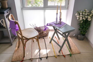 Cozy place for rest with chair and table near window in kitchen