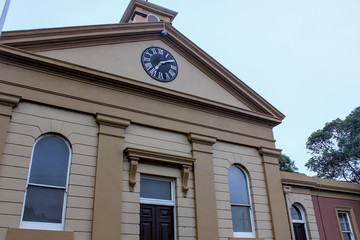 Low angle view of clock on country courthouse