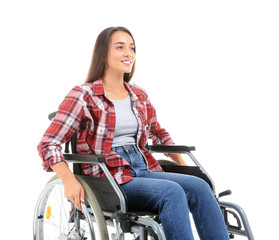 Young woman sitting in wheelchair on white background