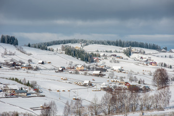Alpine village in winter in Transylvania
