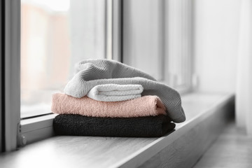 Clean towels on windowsill