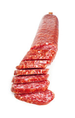 Tasty sliced smoked sausage on white background