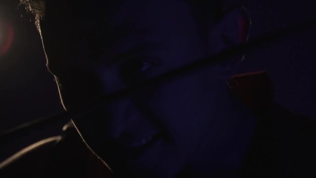 Bloodthirsty Legionnaire with a sword in the dark, sword fighting