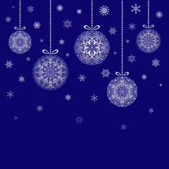 Christmas Balls hanging on blue background snowflakes