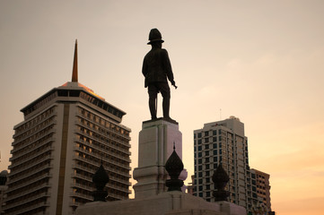 Silhouette of Sunset at King rama VI monument located at the front of Lumpini park Bangkok Thailand.