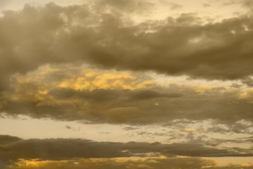 Fototapeta premium beautiful colorful orange sun colored clouds in the sky for using in design as background.