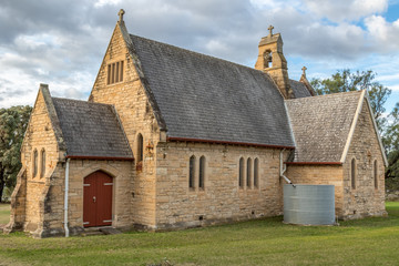 Close up view of sandstone church in country setting