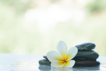 Fototapeta na wymiar spa set on white marble table with sunlight outdoors