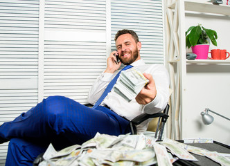 Bank loan or credit. Get cash in few minutes. Banking support line concept. Man successful businessman phone conversation ask service. Businessman rich bearded guy sit office with lot of cash money © be free