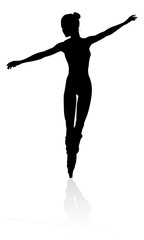 Silhouette of a ballet dancer dancing in a pose or position