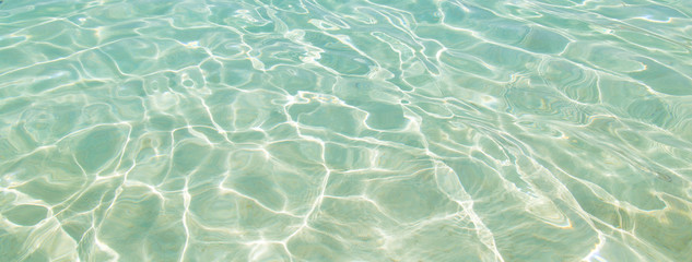 Shining blue water ripple for background. Banner size with copy space.