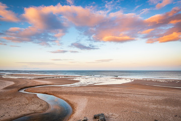 Druridge Bay and Dunbar Burn near sunset / Druridge Bay is a seven mile long beach in...
