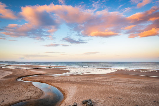 Fototapeta Druridge Bay and Dunbar Burn near sunset / Druridge Bay is a seven mile long beach in Northumberland between Amble to the north and Cresswell to the south
