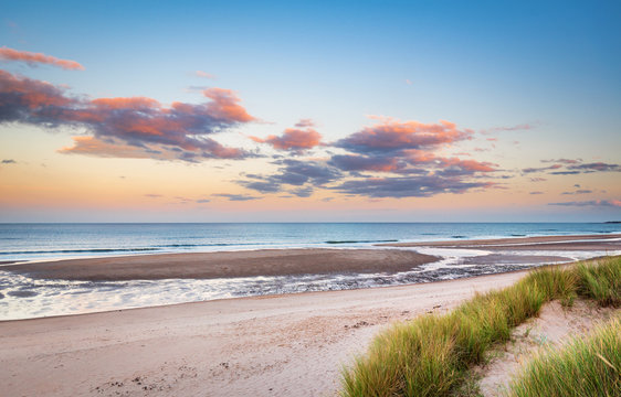 Fototapeta Druridge Bay Sandy Beach near sunset / Druridge Bay is a seven mile long beach in Northumberland between Amble to the north and Cresswell to the south