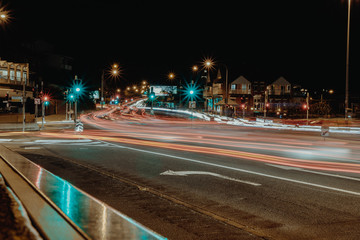 Fototapeta na wymiar Traffic lights on intersection in night time