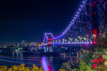Vivid lights of glowing bridge in night