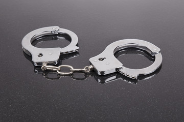 handcuffs on black background
