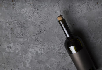 Excellent red wine bottles, wineglass, barrel and corkscrew on a rustic wooden table: traditional...
