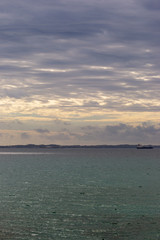 landscape of sea at sunset in a cloudy day