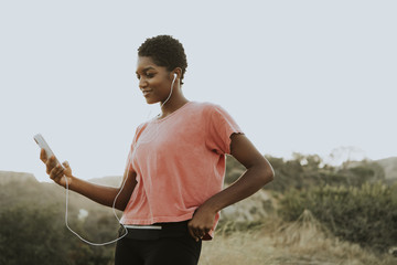 Woman listening to music from the phone
