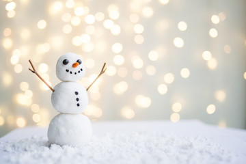Merry christmas and happy new year greeting card with copy-space.Happy snowman standing in winter christmas landscape.Snow background