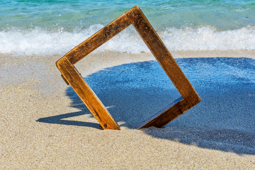 Fototapeta premium wooden picture frame at sea
