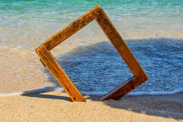 Fototapeta premium wooden picture frame at sea