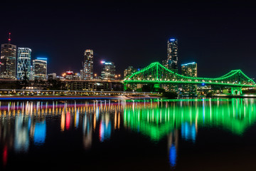 Fototapeta na wymiar Green illumination of city bridge