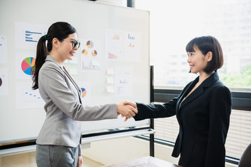 Business people shaking hands agreement concept